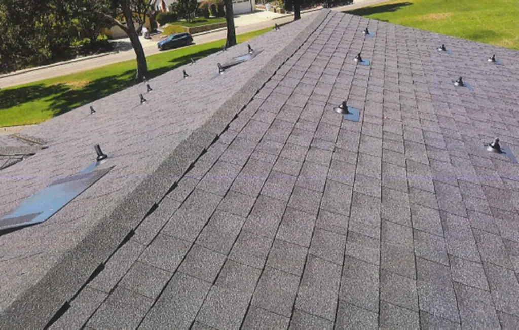 Completed Encinitas roof replacement featuring Owens Corning architectural shingles and low-profile O'Hagin attic vents.